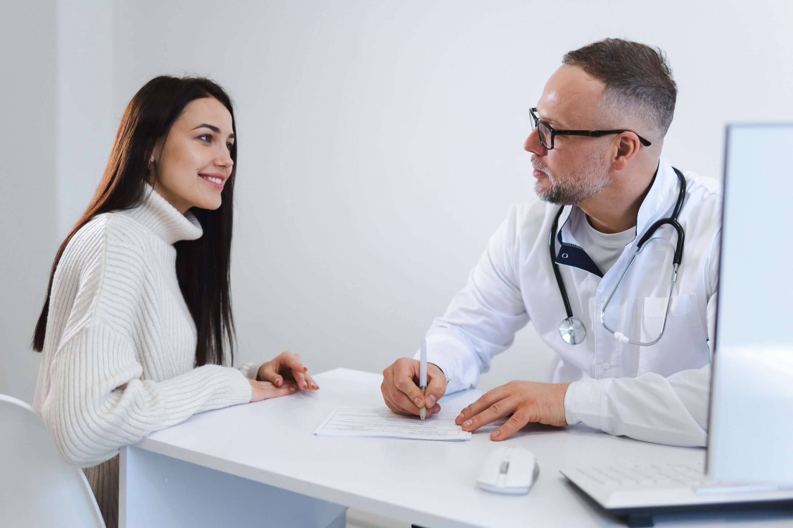Physician_mental_health_screening Physician conducting a mental health screening on a patient